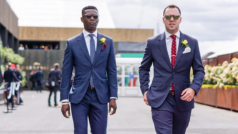 navy blue suit white sneakers