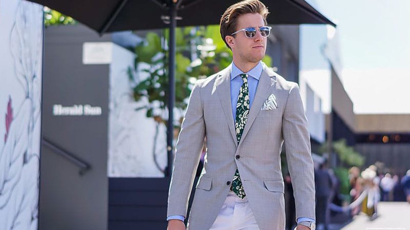 Gray blazer + navy tie + white dress shirt + navy pants + black loafers