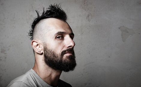 Close Up Portrait Of A Brutal Man With Mohawk. Wide