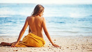 Beautiful Woman Sitting From The Back On Beach, Bali