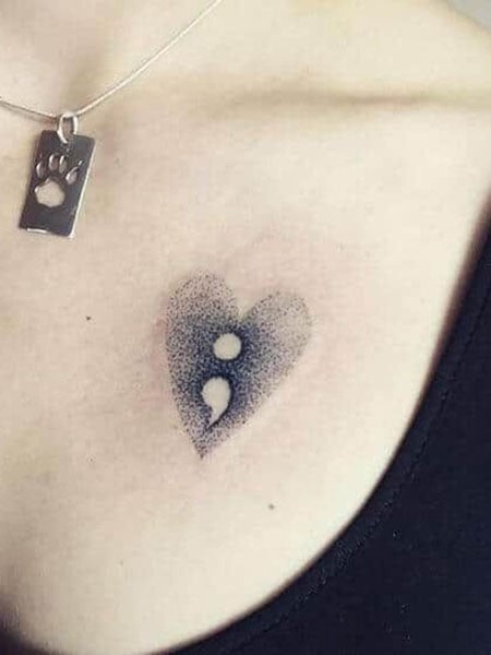 Comma Chest Tattoo