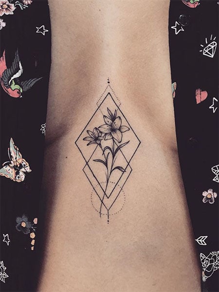 Flower In A Rhombus Tattoo On The Sternum.jpg