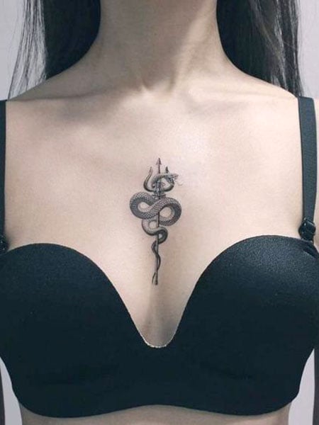 Fine line snake tattoo under the boob