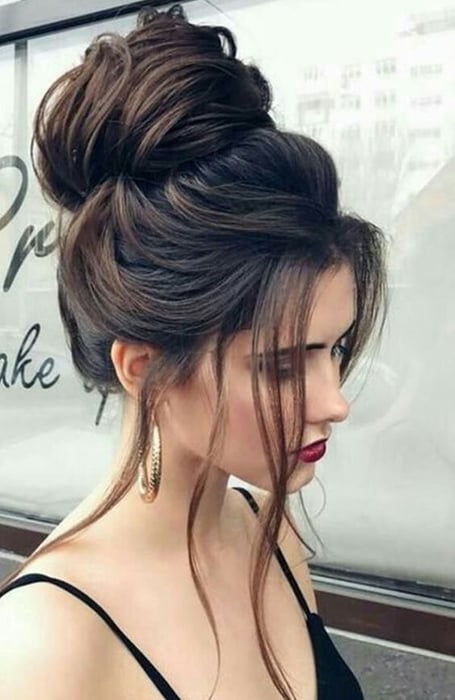 40 Beautiful Updo Hairstyles For 2022 : Loose Side High Bun Hairstyle