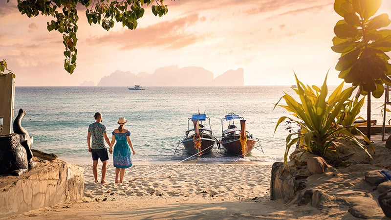 Couple On The Tropical Sunset Beach