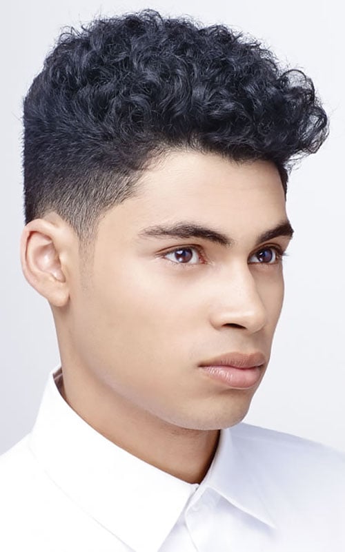 A teenage boy with long curly hair Stock Photo  Alamy