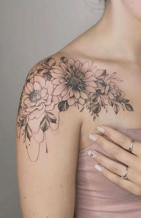 Sunflower tattoos on the right shoulder