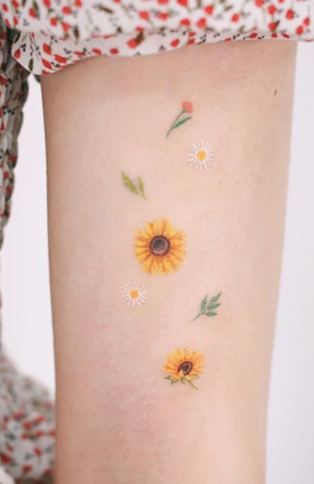 Watercolor sunflower tattoo on the right shoulder