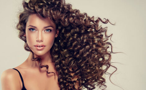 Brunette Girl With Long And Shiny Curly Hair . Beautiful Model W