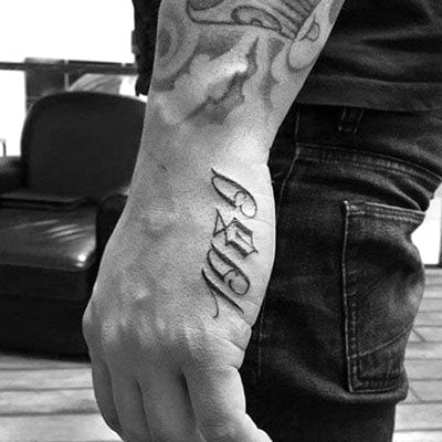 Lover lettering tattoo on the hand