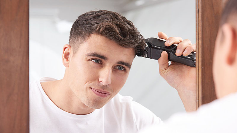 using clippers to trim hair