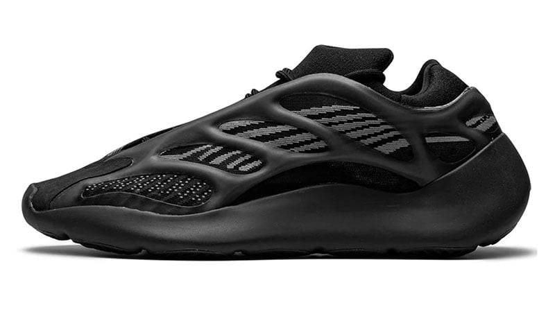 black tennis shoes with black soles