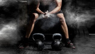 Weightlifter Clapping Hands And Preparing For Workout At A Gym