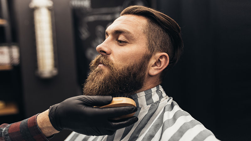 Hipster Young Good Looking Man Visiting Barber Shop. Trendy And