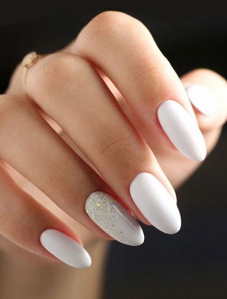 Premium Photo | Beautiful white manicure with stars and glitter