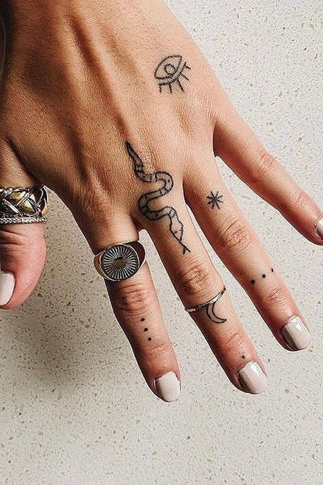 Hand poked snake tattoo on the finger