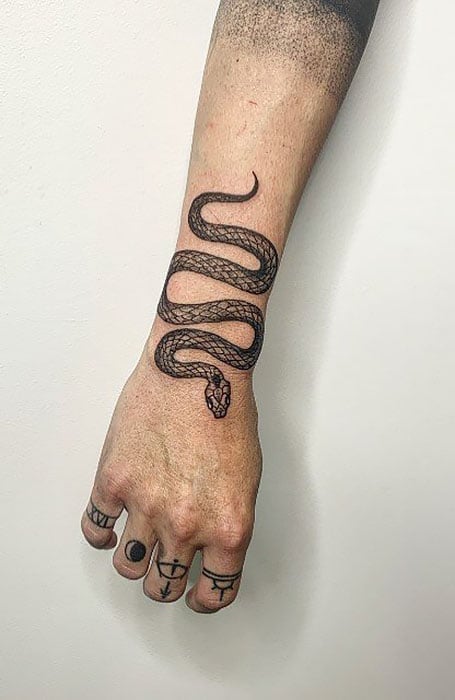 Snake tattoos on the left upper arm