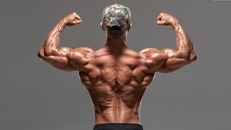Rear View Muscular Man Showing Back Muscles And Biceps, Isolated