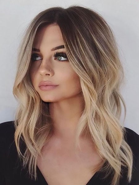 Get one of these alluring medium hairstyles for your round face