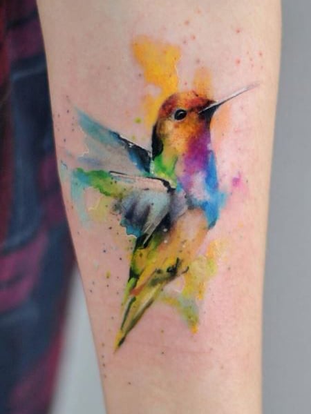 Colorful bird tattoo on foot - FaveThing.com