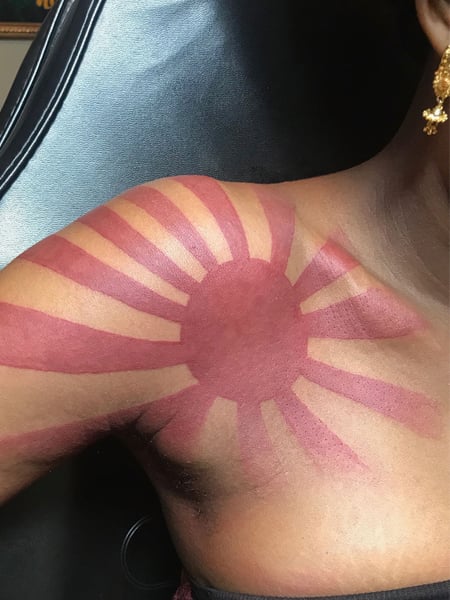 So I want to get this sunset and clouds tattoo in the same spot but I dont  want people to perceive it as the Japanese rising sun What do you guys  perceive