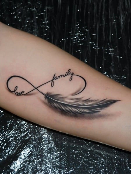 Little feather tattoo located on the hand
