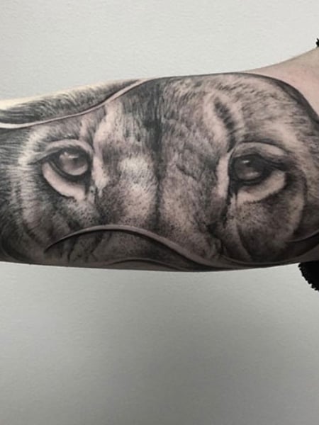 Lion Eyes Tattoo 