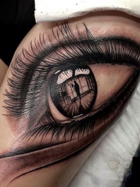 Black and grey realistic eye tattoo