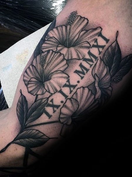 Roman Numerals Arm Tattoo