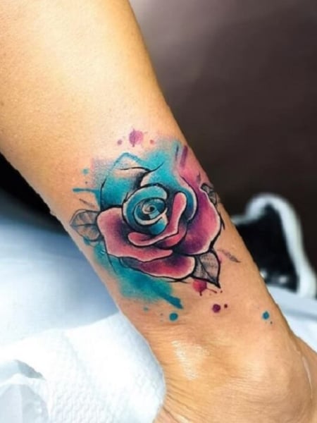 Watercolor rose tattoo on the wrist