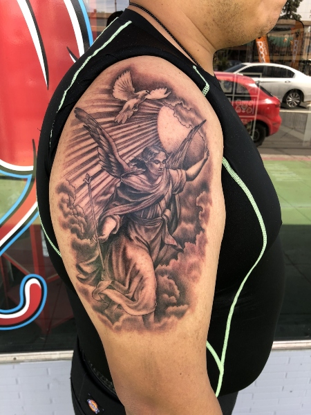 20 Angel Tattoos for Men of Faith (2023) - The Trend Spotter