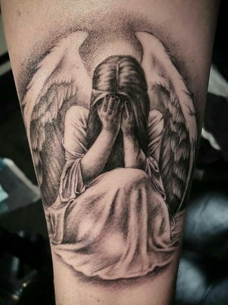 baby angel crying tattoo