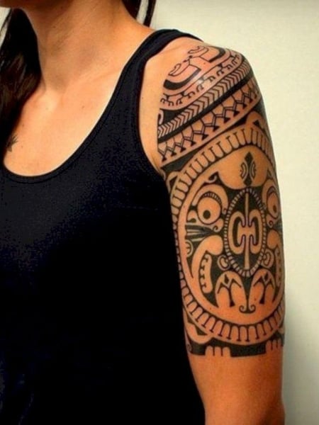 Polynesian style half sleeve and chest tattoo