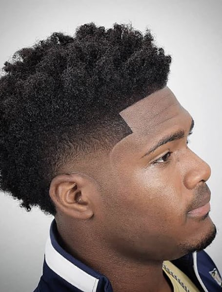 20 Coolest Fade Haircuts For Black Men In 2021 The Trend Spotter Temp fade with hard part. 20 coolest fade haircuts for black men