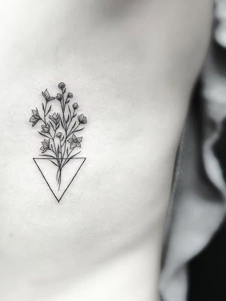 Small Flower Rib Tattoo 