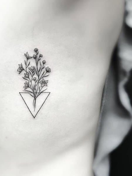 Lisianthus flower tattoo on the left side ribcage