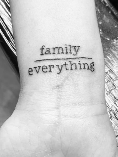 Word family tattooed on the rib