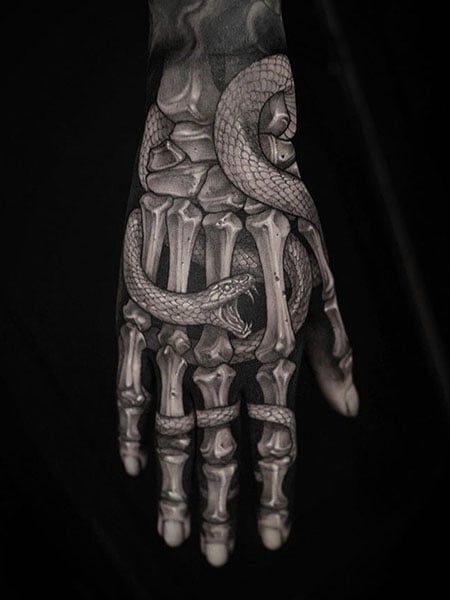 Realistic Skeleton Hand With Snake Tattoo