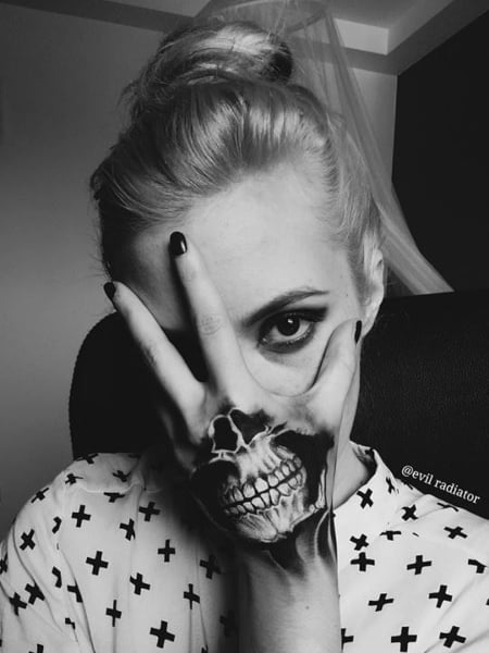 Skeleton Mouth Hand Tattoo