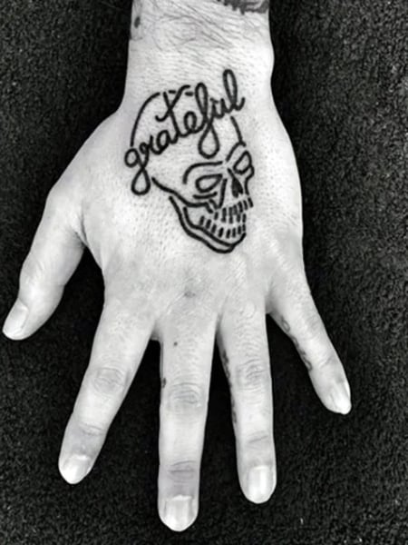 40 Skeleton Hand Tattoo Ideas That Look Cool  TattooTab