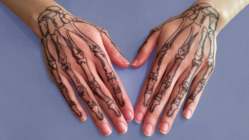 Bones on hands tattoo