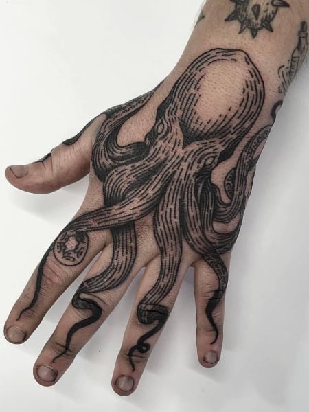 Kraken hand tattoo done by Arron Newport from vintage inx in Essex  Hand  tattoos Tattoos Prison tattoos