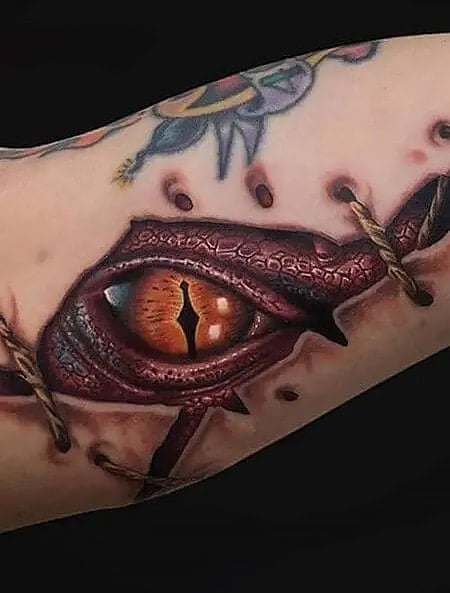 Realistic eye tattoo on the bicep  Tattoogridnet