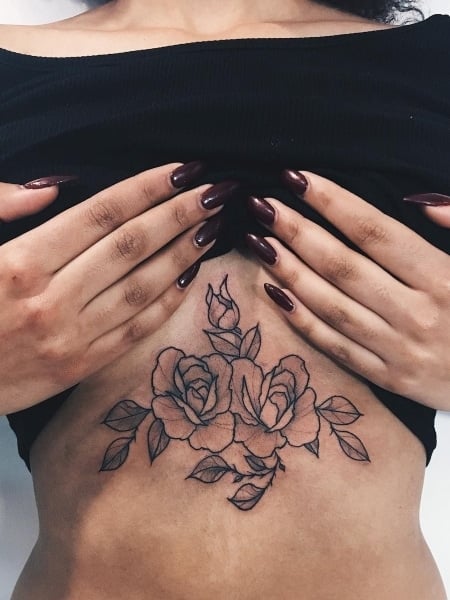 Tiny rose tattoo under the breast