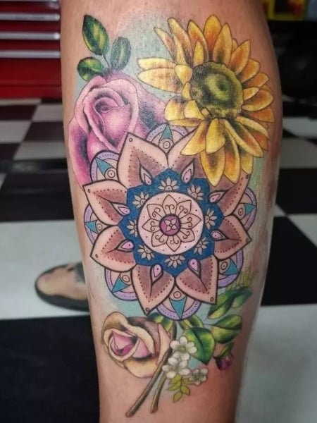 Outline floral tattoo on the left calf  Tattoogridnet