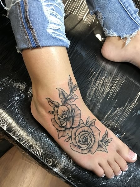 Mountain tattoo on the right foot