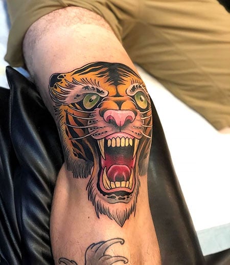 Microrealistic tiger tattoo on the knee