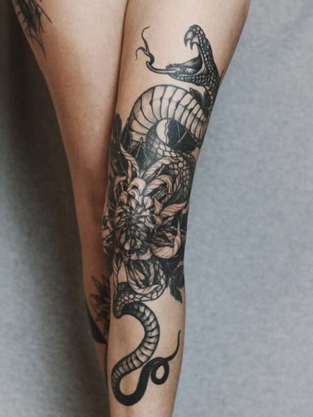 Tattoo uploaded by Alexey Vorobyov • snake around the leg #snake  #blacktattoo • Tattoodo