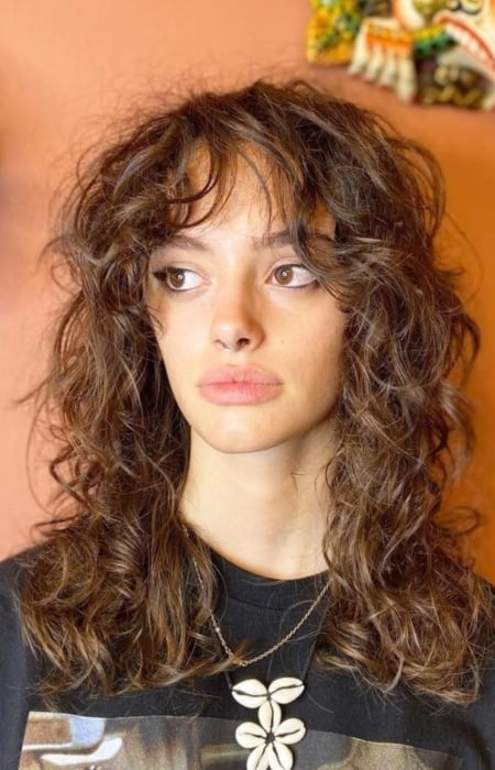 Curly Hair Wolf Cut With Wispy Bangs