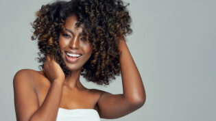 Portrait Of Cheerful Black Woman Isolated On Gray Background